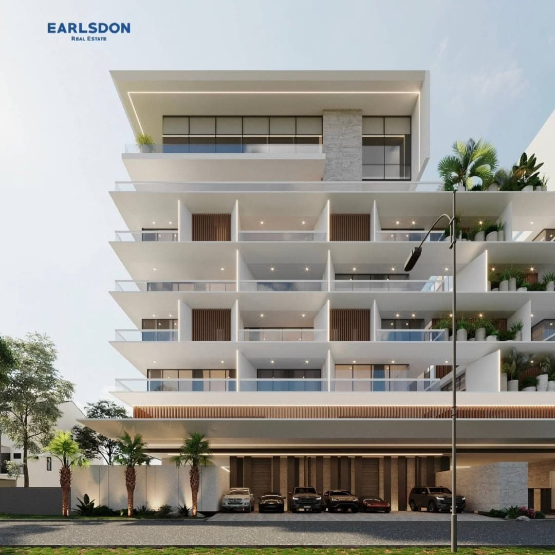 Earlsdon development: a white terraced apartment block with planted balconies