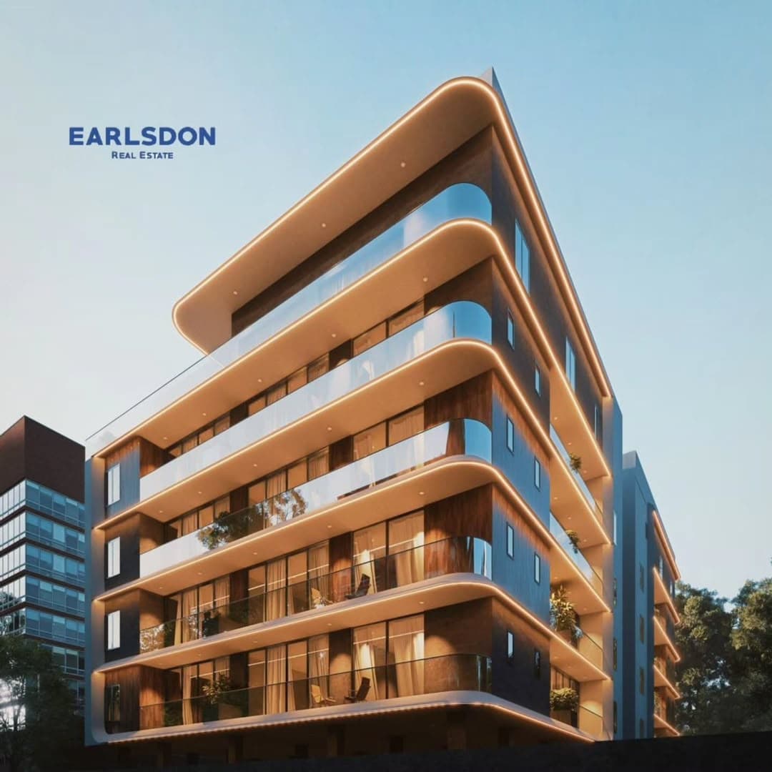 Earlsdon development: a curved apartment tower with warm-lit balcony edges
